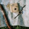 White and Brown Camera on White and Blue Painted Wall